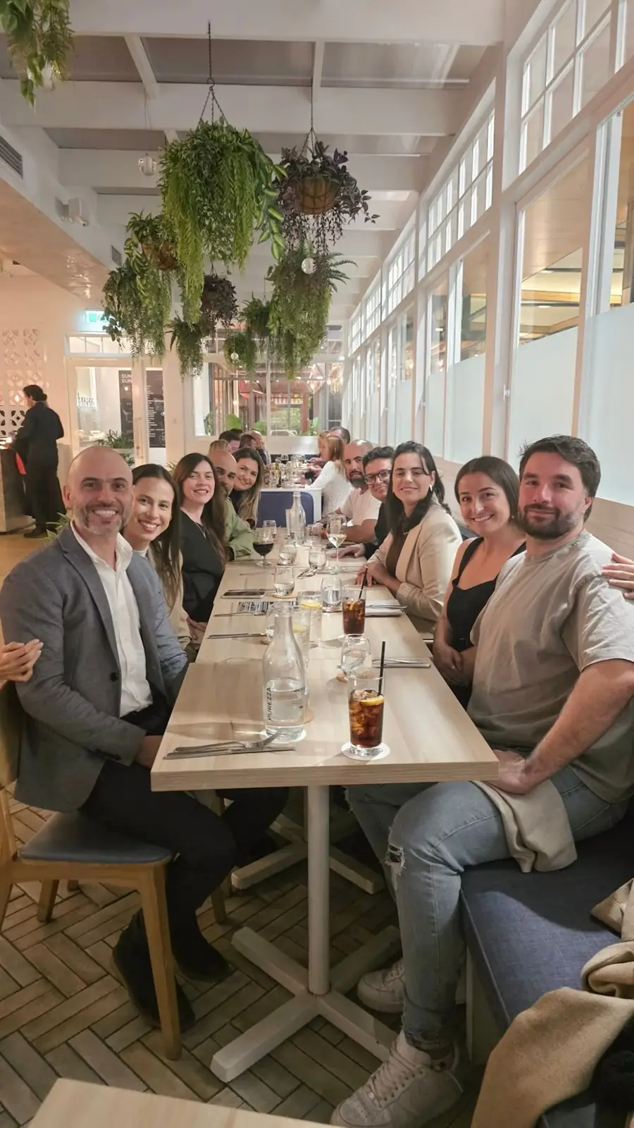 Builder Lab community seated around a long table